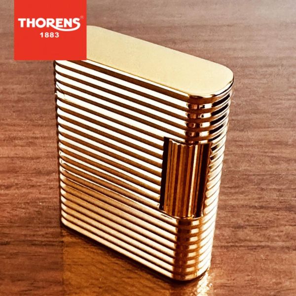 Роскошная газовая зажигалка THORENS в золотом сияющем цвете.