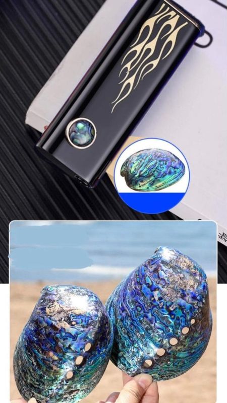 Газовая индукционная зажигалка черного цвета украшена золотистым узором в виде языков пламени